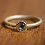 Dainty Blue Topaz Gold Solitaire