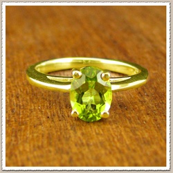 Oval Peridot Engagement Ring in Gold