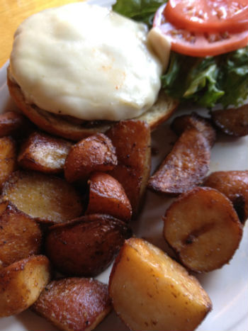 the fine provolone-topped burger and home fries that Alicia ordered the fine provolone-topped burger and home fries that Alicia ordered