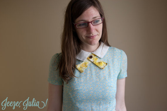Julia modeling one of the organic continental ties from her shop